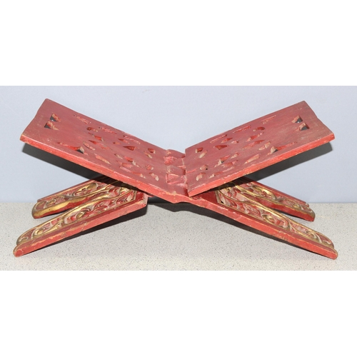 293 - A vintage red and gilt folding bookrest, possibly Chinese, approx 53cm wide when open