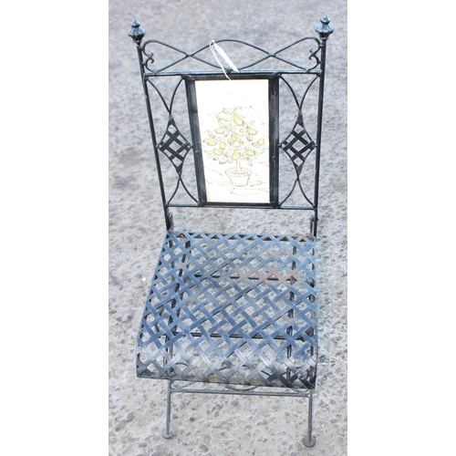 318 - Folding metal patio table and 2 chairs, the table approx 64cm wide