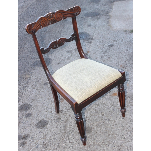 84 - A set of 4 Regency/ William IV period dining chairs with carved backs and reeded legs