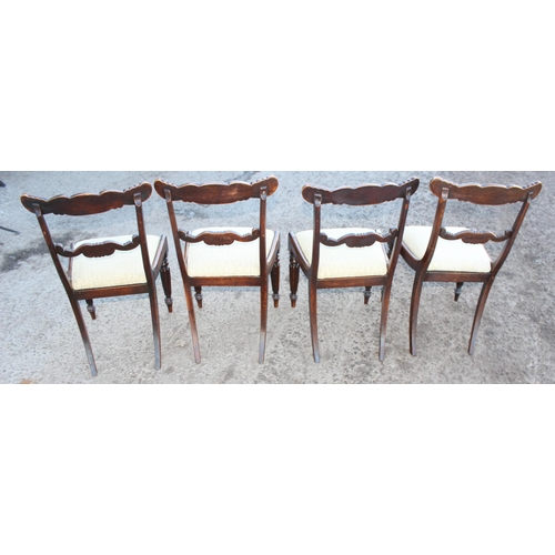 84 - A set of 4 Regency/ William IV period dining chairs with carved backs and reeded legs