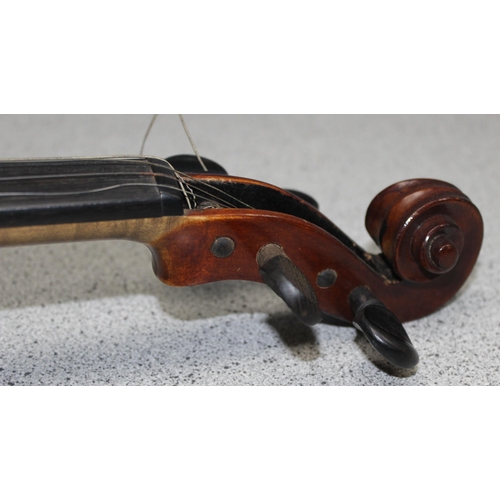 624 - A vintage violin in case, German made copy of a Stradivarius with label inside, first half 20th cent... 