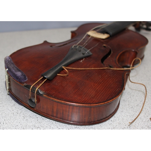 624 - A vintage violin in case, German made copy of a Stradivarius with label inside, first half 20th cent... 