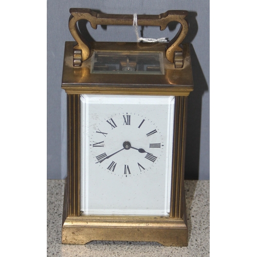 1328 - French made brass cased carriage clock with enamelled dial, key present