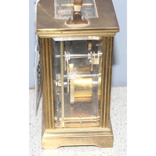 1328 - French made brass cased carriage clock with enamelled dial, key present