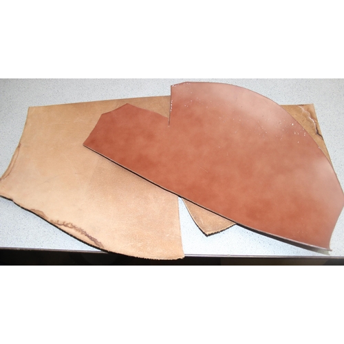 220 - Box of large off cuts of tan-coloured material to incl leather