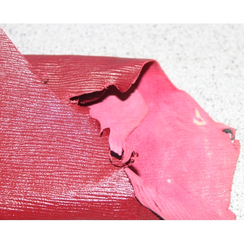 223 - Qty material offcuts in different shades of red to incl leather and suede, various thickness