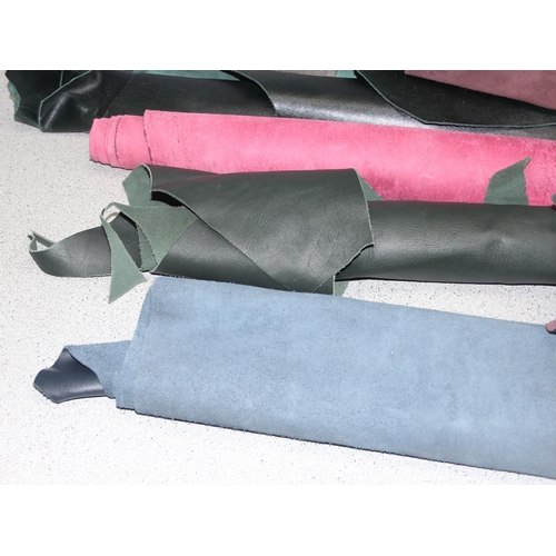 228 - Qty of mixed material small rolls/offcuts, mostly leather of various colours and thickness