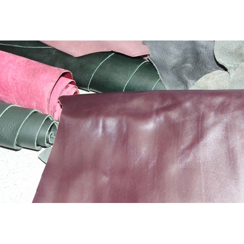 228 - Qty of mixed material small rolls/offcuts, mostly leather of various colours and thickness