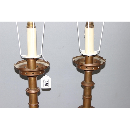 250 - A large pair of 19th century ecclesiastical candlesticks later formed into lamps, with shades, appro... 