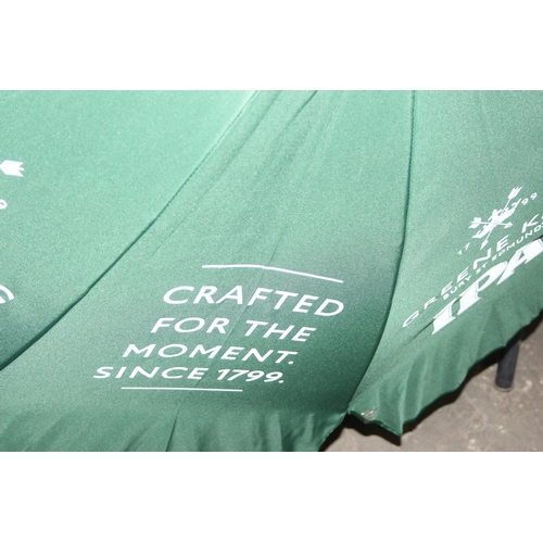 315 - 6 x Greene King IPA garden table parasols in green, seemingly unused