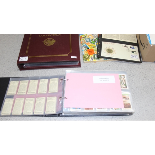 517 - Qty of mixed stamps, First Day Covers, picture/tea cards in album and postcards etc