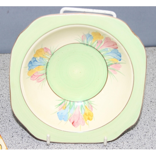 1672 - Clarice Cliff, a rare Biarritz pattern square plate decorated with flowers and wicker handle and a C... 