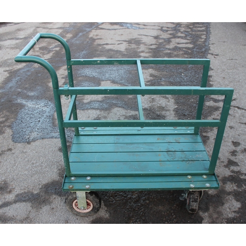 319 - A green garden utility trolley, approx 93cm wide x 62cm deep x 95cm tall