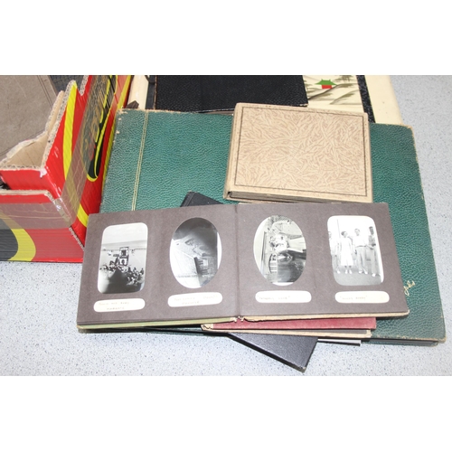 551 - Mix of vintage and later photographs and ephemera in albums