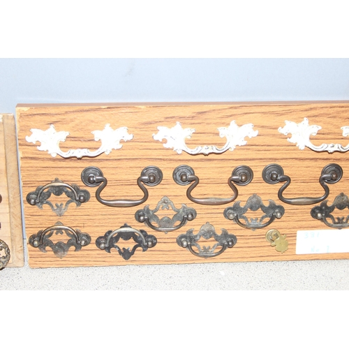 829 - Qty of assorted drawer handles mounted on boards (4)