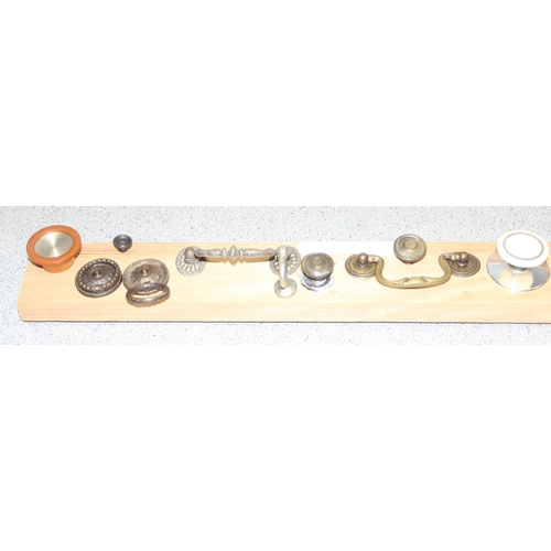 829 - Qty of assorted drawer handles mounted on boards (4)