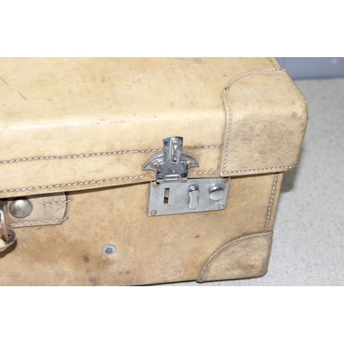 202 - Large vintage travelling suitcase in cream, approx 67cm x 40cm x 22cm