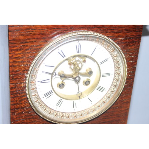 1306 - Mahogany cased mechanical mantel clock, approx 33cm tall