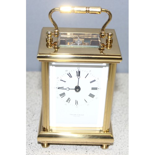 1307 - Boxed brass skeleton 11 jewels carriage clock by Taylor & Blight, with key, inscription to base