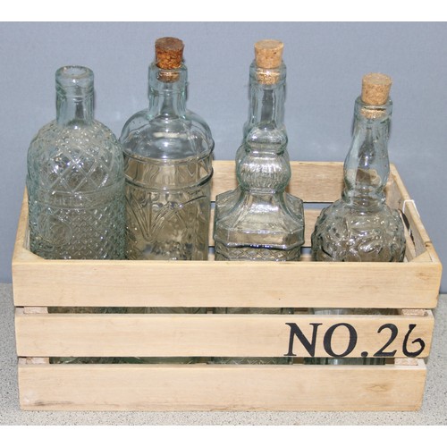 1705 - Small wooden crate with 4 decorative glass bottles with corks