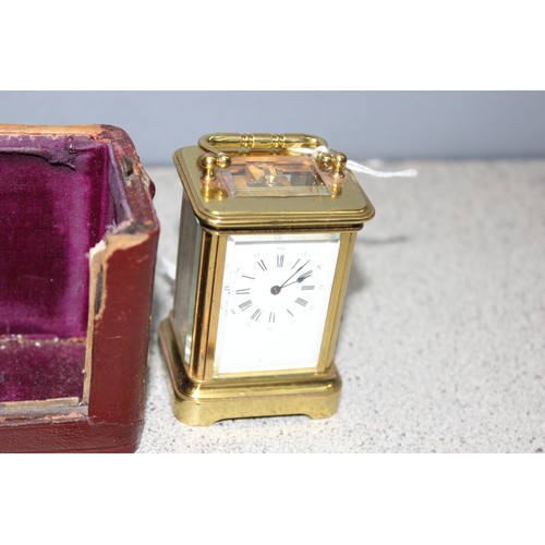 1334 - A rare antique miniature brass cased carriage clock in original leather case, likely late 19th centu... 