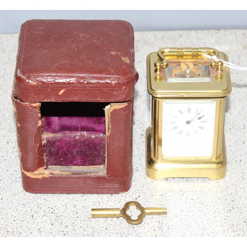 1334 - A rare antique miniature brass cased carriage clock in original leather case, likely late 19th centu... 