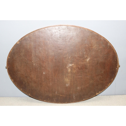 434 - Large Edwardian mahogany framed oval wall mirror with bevelled edge and inlay details, approx 82 x 6... 