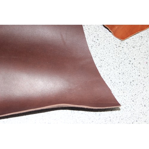 224 - Qty of leather offcuts of various thickness/shades of tan/brown