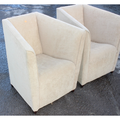 48 - A pair of modern cream upholstered tub chairs, each approx 76cm wide x 65cm deep x 80cm tall