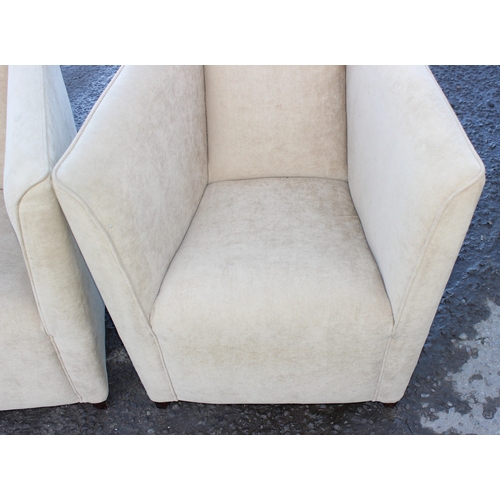 48 - A pair of modern cream upholstered tub chairs, each approx 76cm wide x 65cm deep x 80cm tall