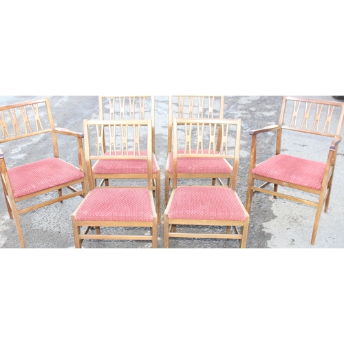 30 - A set of 6 retro dining chairs with red upholstered seats, 4 dining and 2 carver, seemingly unmarked