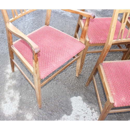 30 - A set of 6 retro dining chairs with red upholstered seats, 4 dining and 2 carver, seemingly unmarked