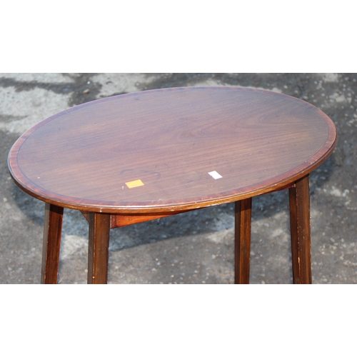 37 - An Edwardian Sheraton Revival mahogany side table with thin tapering legs and oval top, approx 53cm ... 