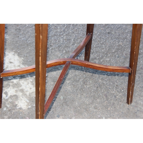 37 - An Edwardian Sheraton Revival mahogany side table with thin tapering legs and oval top, approx 53cm ... 