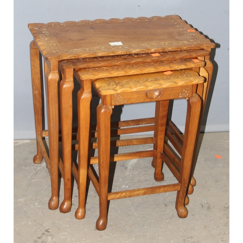 45A - A nest of 4 Indian carved wooden table, the largest approx 52cm wide x 33cm deep x 52cm tall