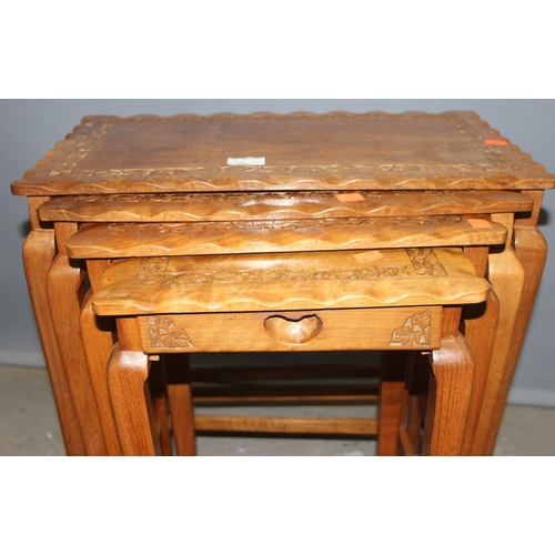 45A - A nest of 4 Indian carved wooden table, the largest approx 52cm wide x 33cm deep x 52cm tall