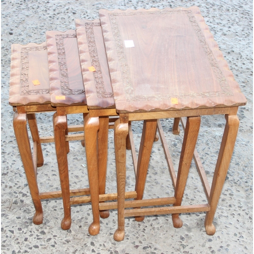 45A - A nest of 4 Indian carved wooden table, the largest approx 52cm wide x 33cm deep x 52cm tall