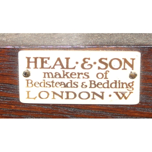 190 - An early 20th century Mahogany bed head and footboard by Heal & Son of London, with side rails but n... 