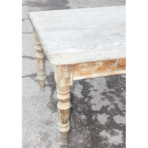 123 - A 19th century pitch pine farmhouse kitchen table with single drawer, approx 136cm wide x 85cm deep ... 