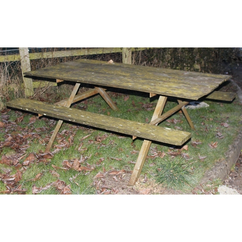 311 - A vintage weathered wooden garden picnic bench with metal frame, approx 183cm wide x 143cm deep x 72... 