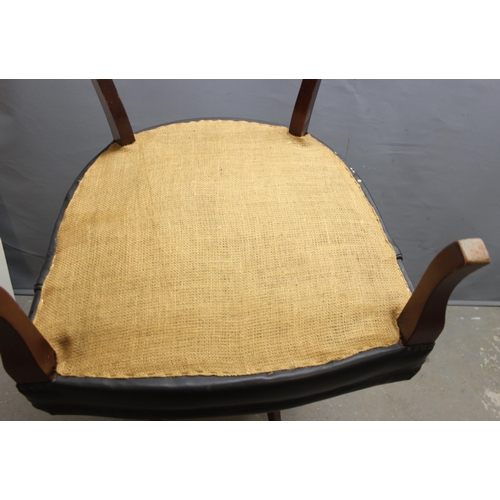 184 - A pair of Georgian style button back dark green leather or leatherette Chesterfield club chairs with... 