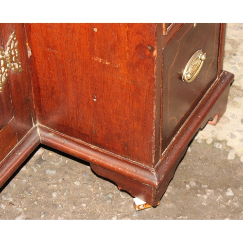 186 - A 19th century mahogany and Sheraton style satinwood inlaid kneehole desk with 8 drawers and a cupbo... 