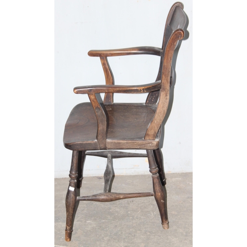 101 - An antique elm seated Oxford armchair, approx 84cm tall