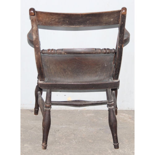 101 - An antique elm seated Oxford armchair, approx 84cm tall