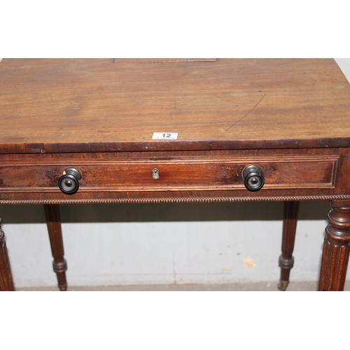 12 - In the manner of Gillows of Lancaster, a Regency period mahogany Chamber writing table, a mahogany t... 