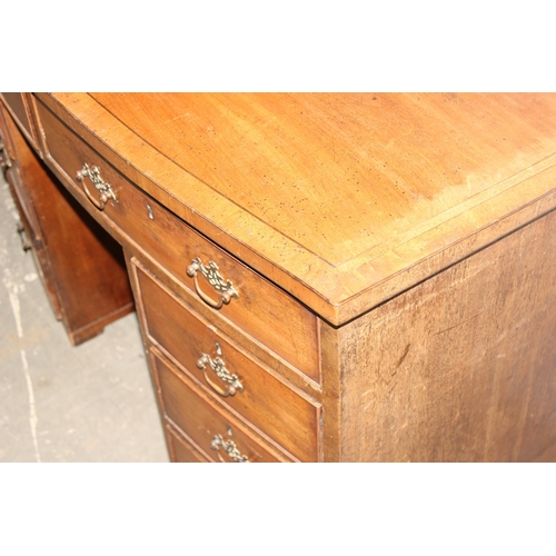 13 - A 19th century mahogany kneehole desk of 8 drawer construction with Georgian style brass handles, ap... 