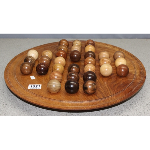 1521 - An impressive modern specimen wood solitaire board with wooden pieces, a large variety of turned woo... 