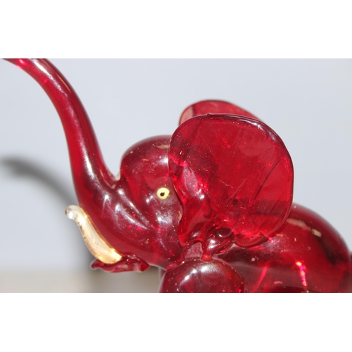 1612 - Attributed to Vetreira Artistica Barovier or Martinuzzi, a small red glass model of an elephant walk... 