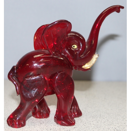 1612 - Attributed to Vetreira Artistica Barovier or Martinuzzi, a small red glass model of an elephant walk... 