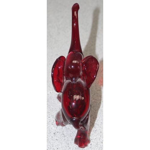 1612 - Attributed to Vetreira Artistica Barovier or Martinuzzi, a small red glass model of an elephant walk... 